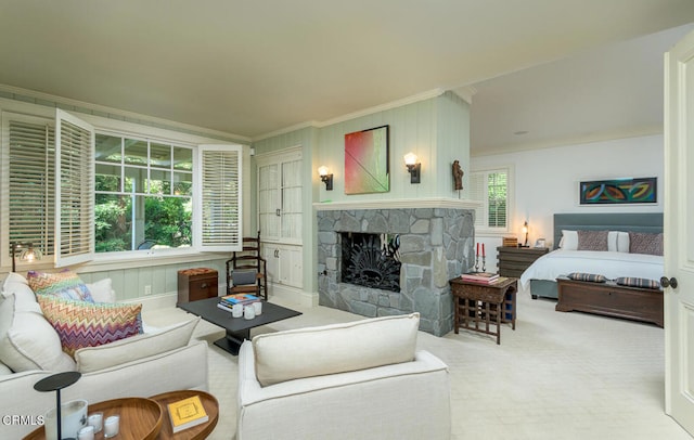 carpeted living room featuring ornamental molding and a fireplace