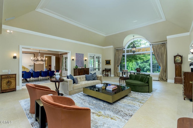 living room with a tray ceiling, crown molding, a chandelier, and a high ceiling