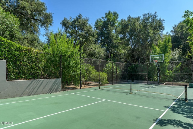 view of sport court featuring tennis court