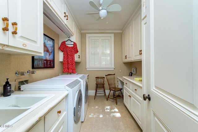 washroom with cabinets, sink, washing machine and clothes dryer, crown molding, and ceiling fan