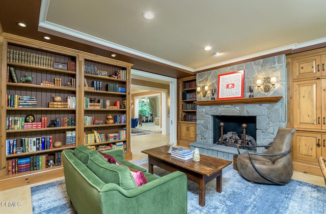 sitting room with a fireplace and ornamental molding