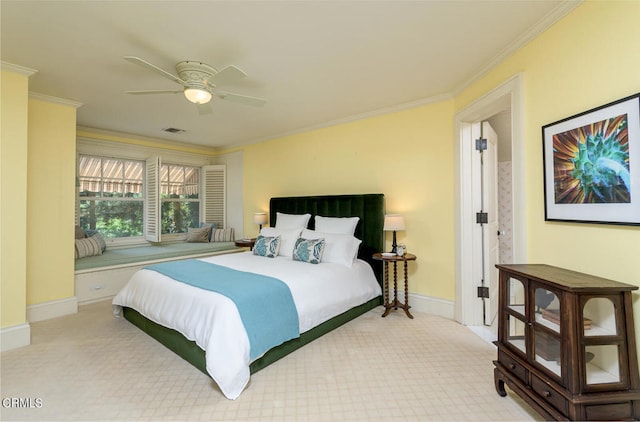 bedroom featuring crown molding, light carpet, and ceiling fan