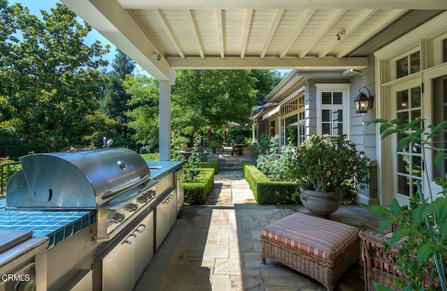 view of patio with exterior kitchen and area for grilling