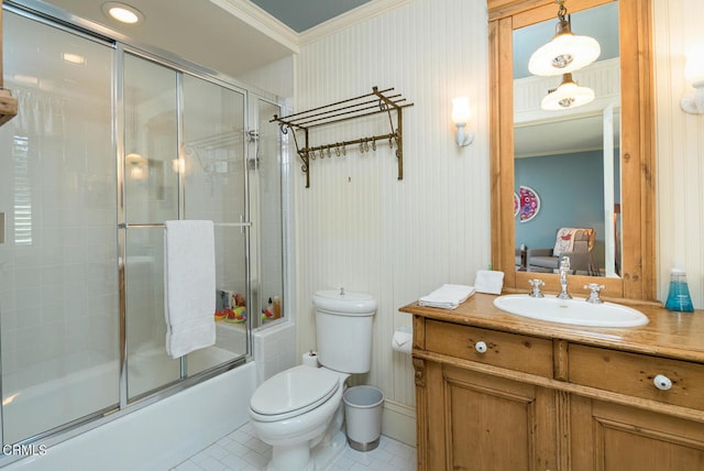 full bathroom with vanity, toilet, bath / shower combo with glass door, crown molding, and tile patterned flooring