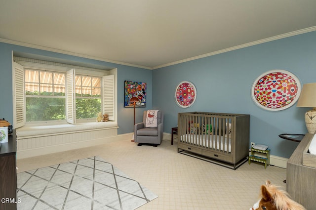 bedroom with crown molding, carpet flooring, and a nursery area