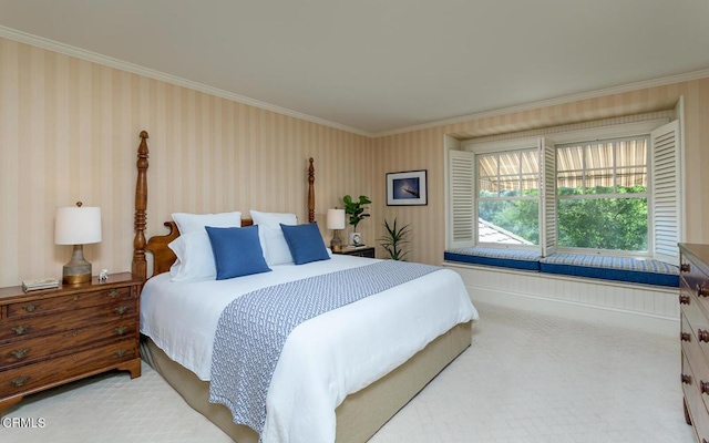 bedroom with ornamental molding and carpet floors