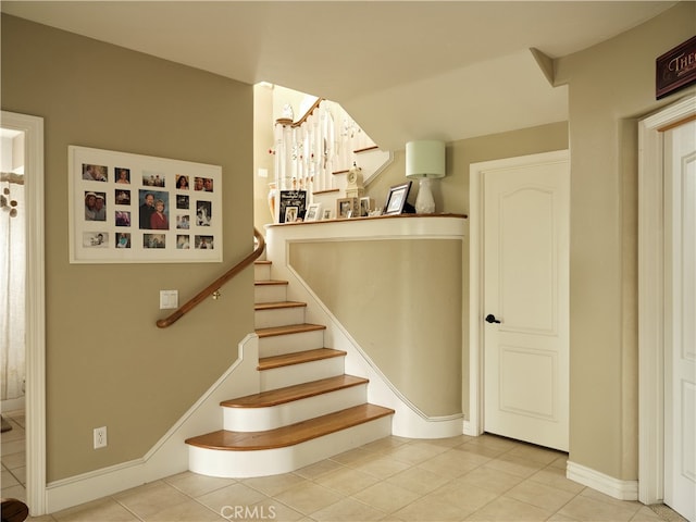 stairs featuring tile patterned floors