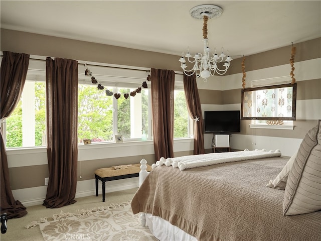 carpeted bedroom with a chandelier and multiple windows