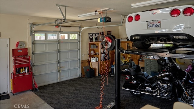 garage featuring a garage door opener