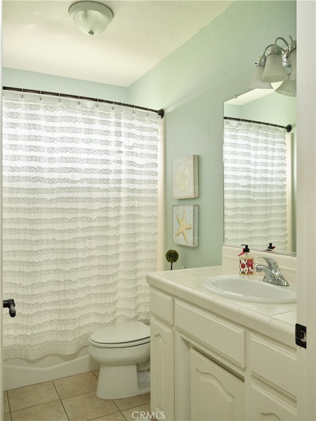 full bathroom with vanity, toilet, tile patterned floors, and shower / bath combination with curtain