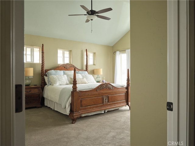 carpeted bedroom featuring vaulted ceiling and ceiling fan