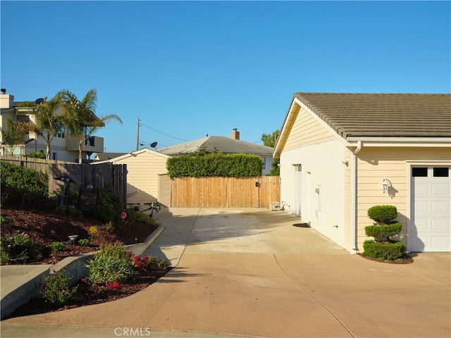 view of property exterior featuring a garage