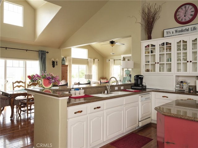 kitchen featuring dark wood-type flooring, white cabinets, dishwasher, ceiling fan, and sink