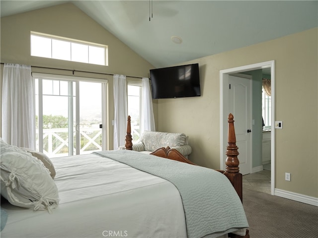 bedroom with carpet floors and high vaulted ceiling