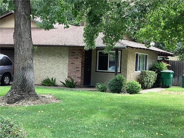 ranch-style house with a front lawn