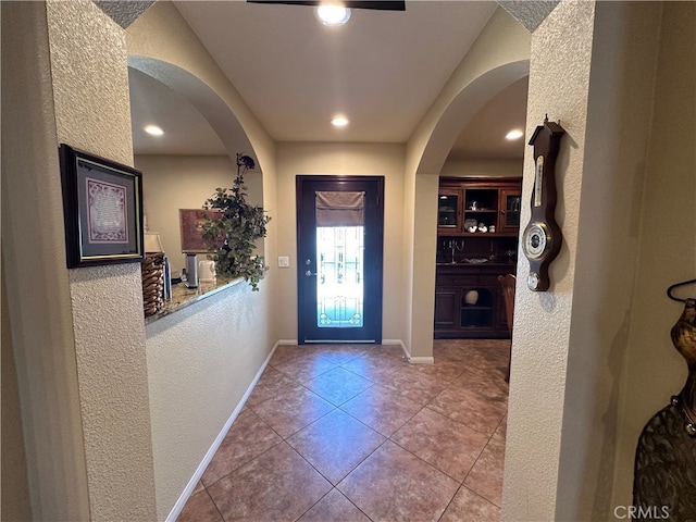 entryway featuring light tile patterned floors