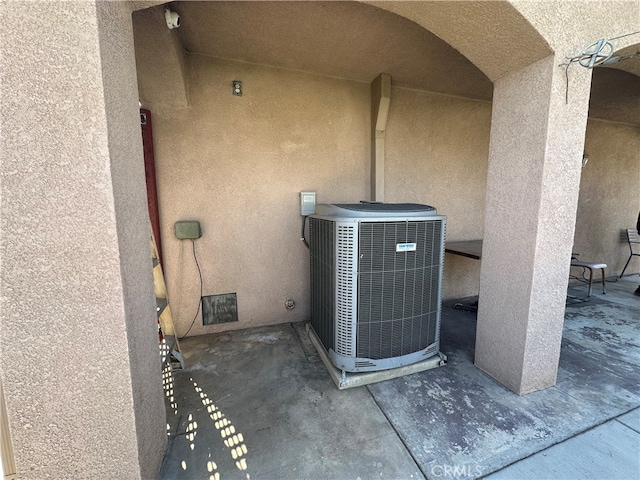 details featuring central AC unit and concrete floors