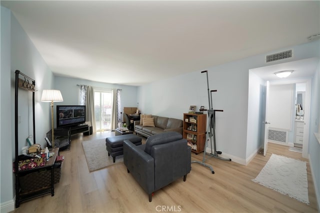 living room with light hardwood / wood-style flooring