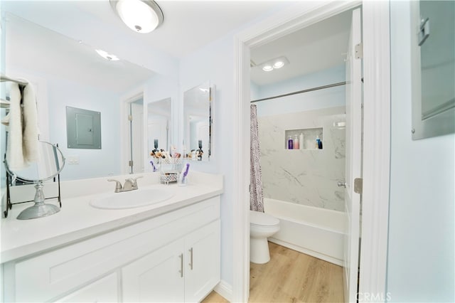 full bathroom with vanity, electric panel, hardwood / wood-style flooring, shower / bathtub combination with curtain, and toilet