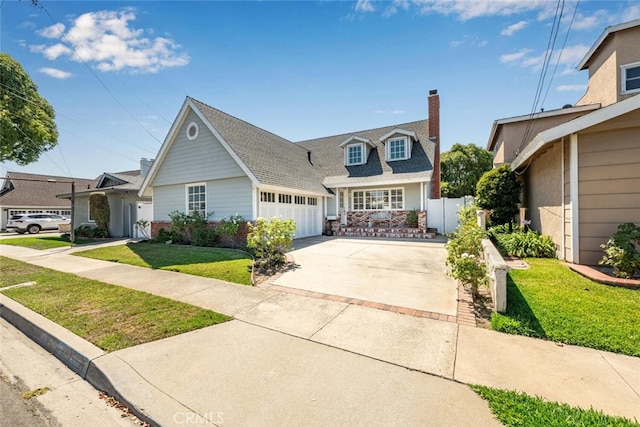 view of front of property featuring a garage and a front yard