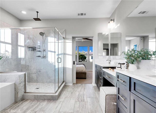 bathroom with ceiling fan, vanity, and an enclosed shower