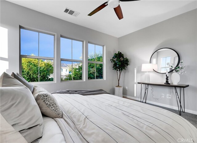 carpeted bedroom with ceiling fan