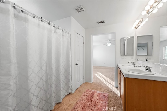 bathroom featuring vanity and ceiling fan