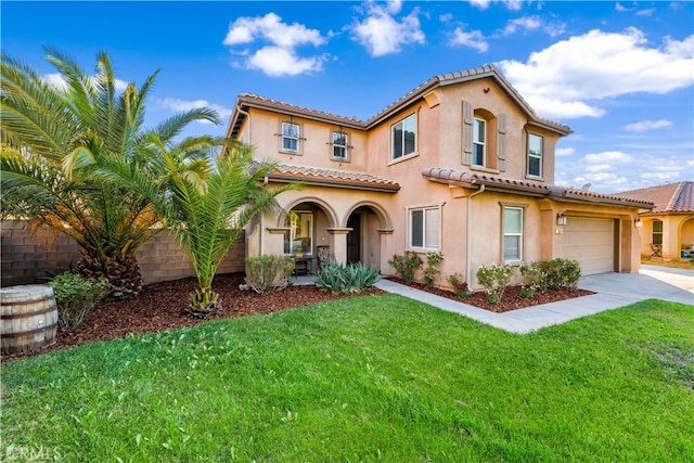 mediterranean / spanish-style home with a front lawn and a garage