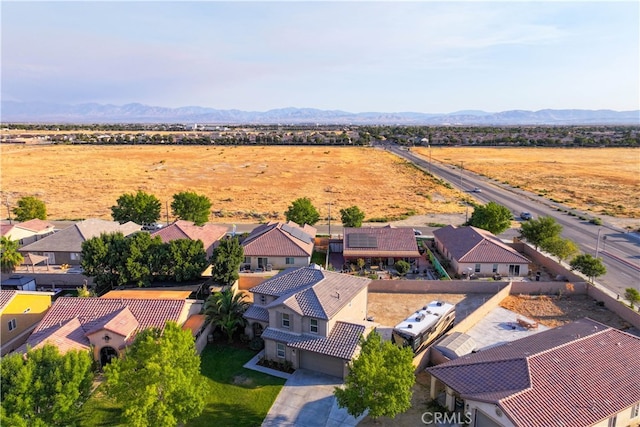 drone / aerial view featuring a mountain view