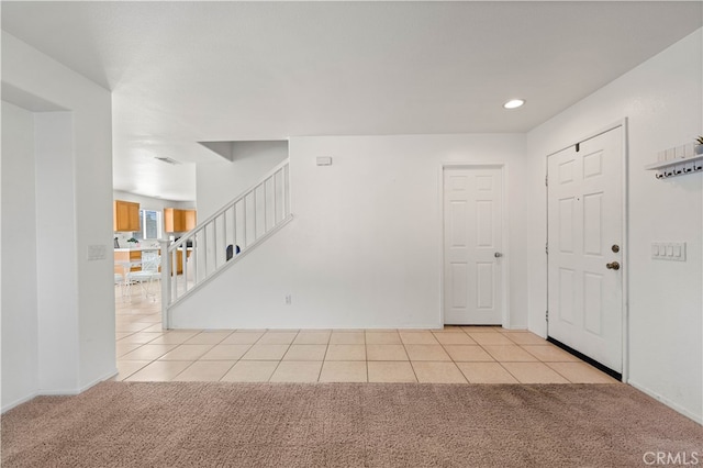 view of carpeted entrance foyer