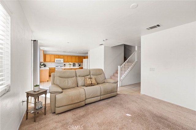 living room featuring light colored carpet