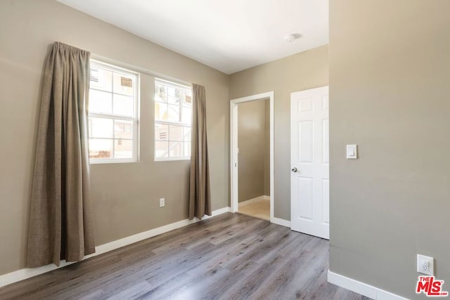 unfurnished bedroom featuring light wood-type flooring