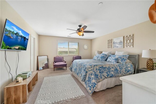 carpeted bedroom featuring ceiling fan