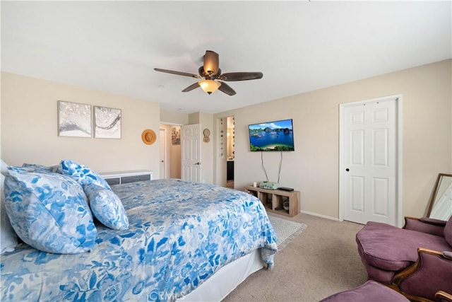 carpeted bedroom with baseboards and ceiling fan