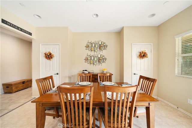 dining space with light tile patterned flooring