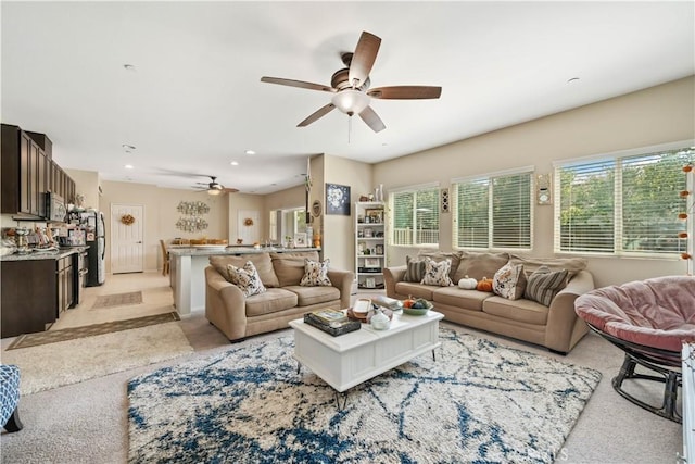 living area with light colored carpet, recessed lighting, and a ceiling fan