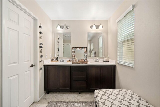 bathroom featuring vanity and a shower with shower door