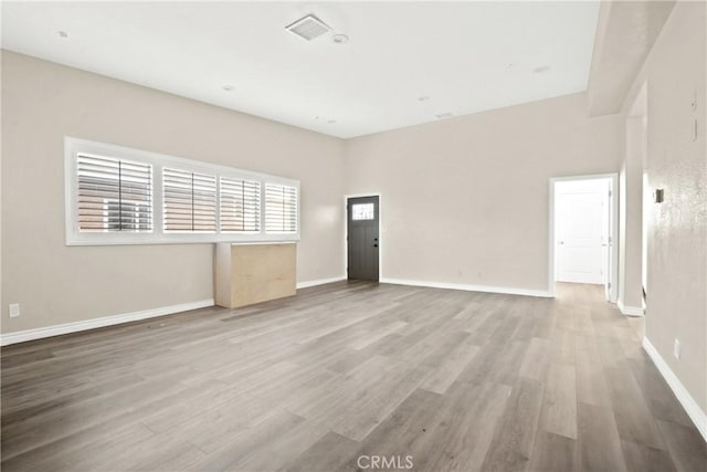 unfurnished room featuring hardwood / wood-style flooring