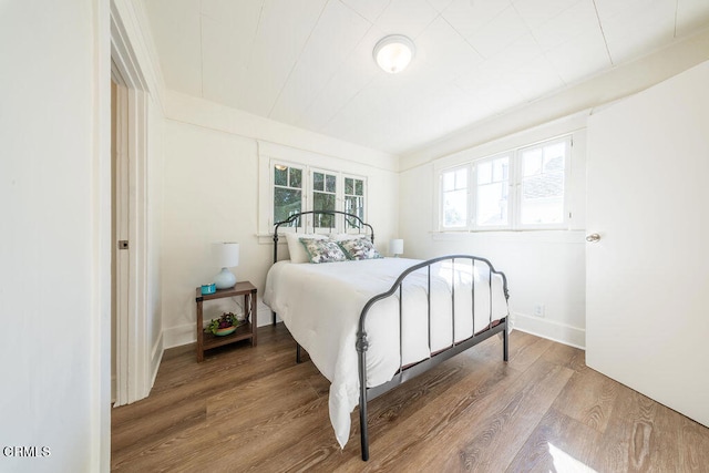 bedroom with wood-type flooring