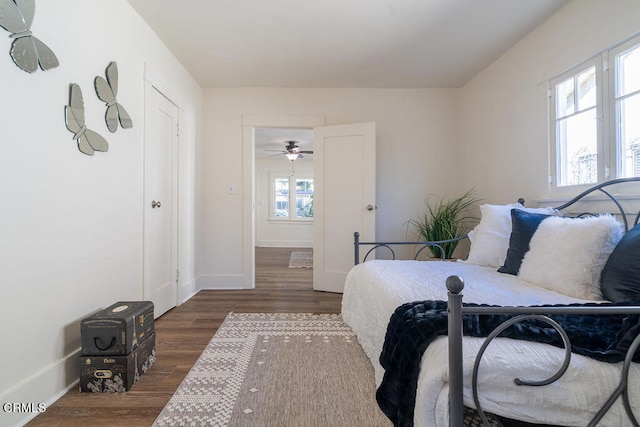 bedroom with dark wood-type flooring