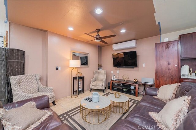 living room with ceiling fan, a wall mounted AC, and light tile patterned flooring