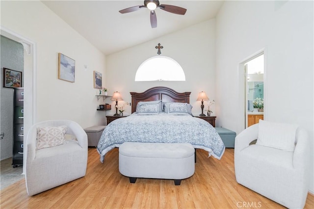 bedroom with hardwood / wood-style flooring, high vaulted ceiling, and ceiling fan