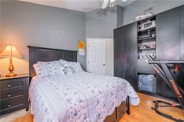 bedroom with ceiling fan and light hardwood / wood-style flooring