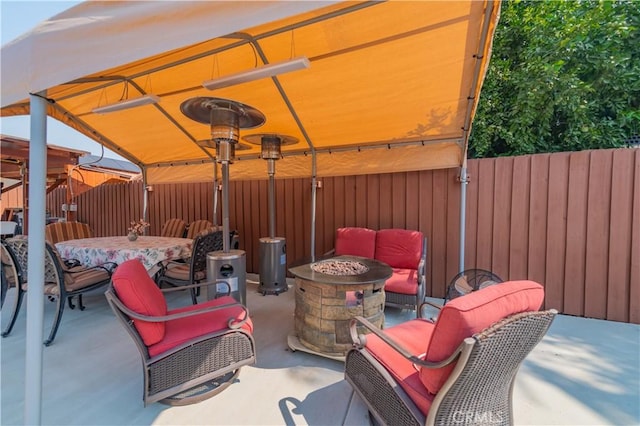 view of patio with a fire pit