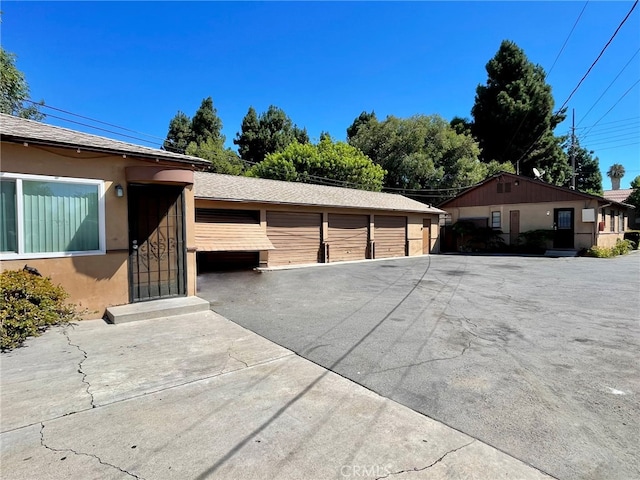 view of property exterior with a garage