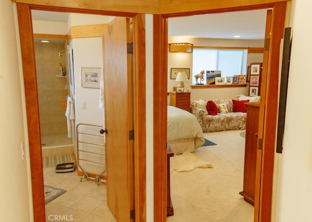 hallway with light colored carpet