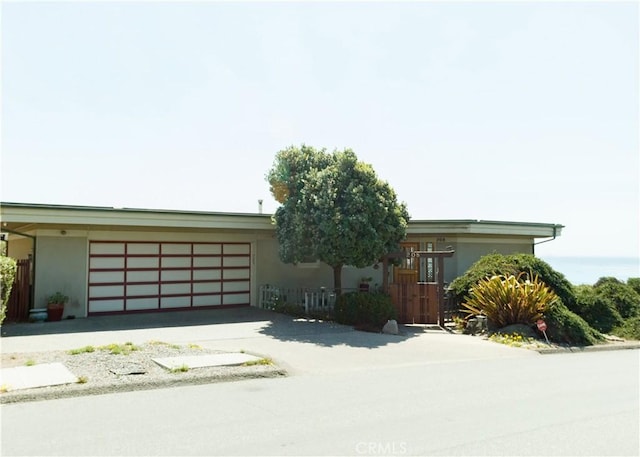 ranch-style house featuring a garage