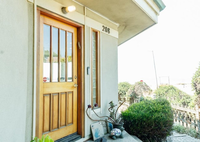 property entrance with covered porch