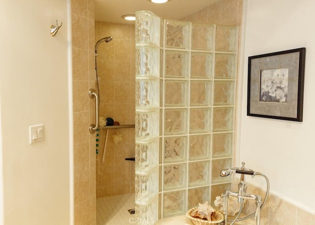 bathroom with tiled shower