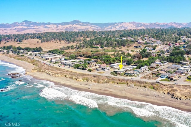 aerial view with a view of the beach and a water and mountain view